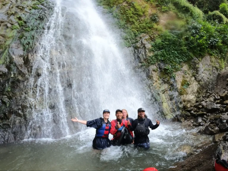 Group enjoying a waterfall in Sun koshi