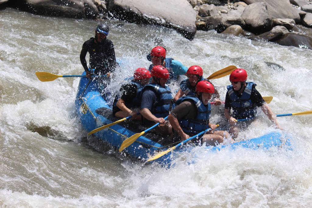 Close shot of people rafting in high tide