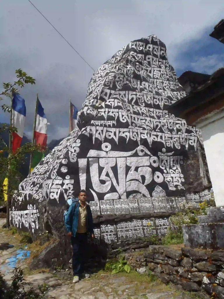 Saroj in front of sacred rock